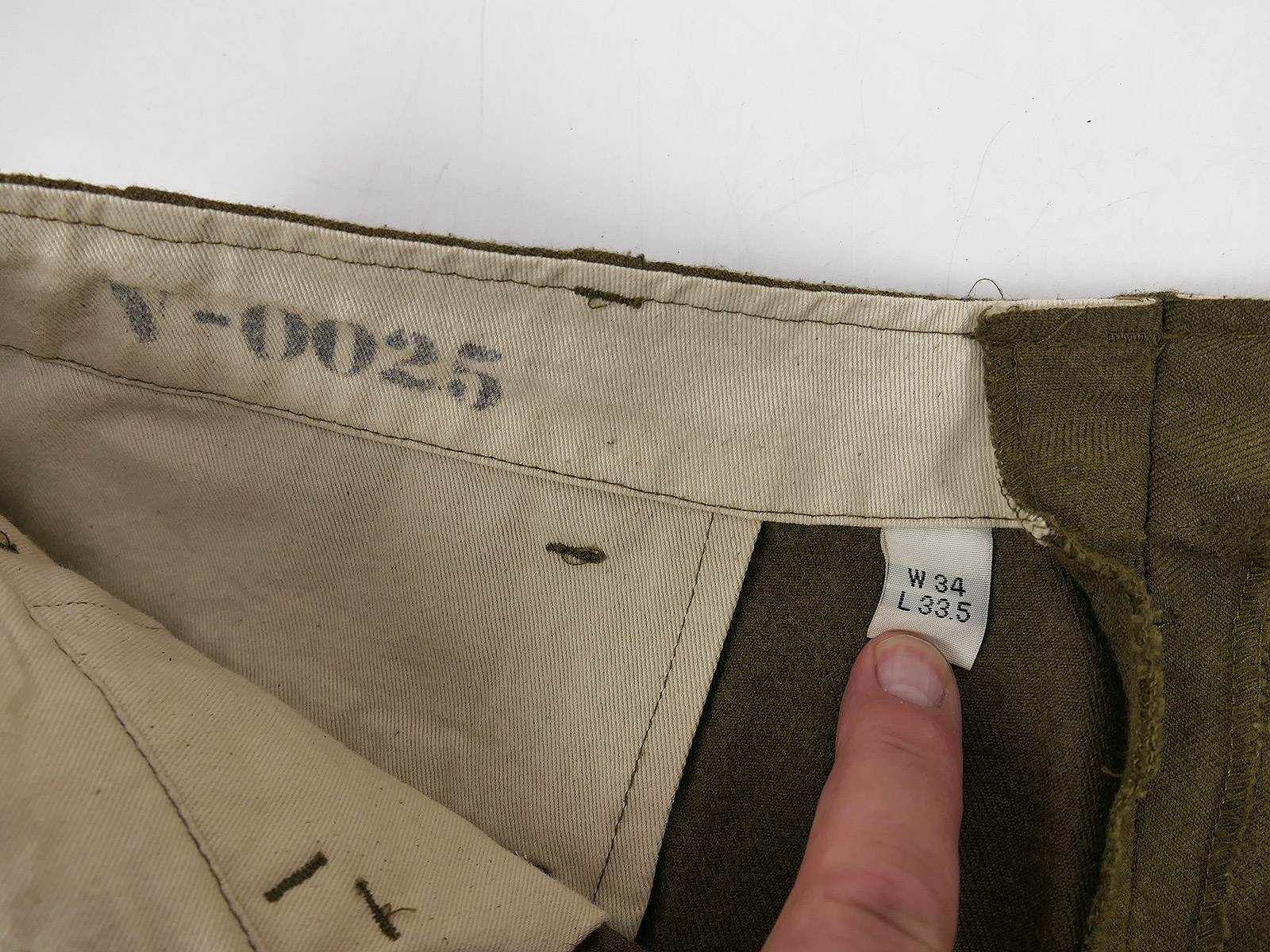 One-off pair of US Army WW2 M37 field trousers, size US W34, BATTLE WORN