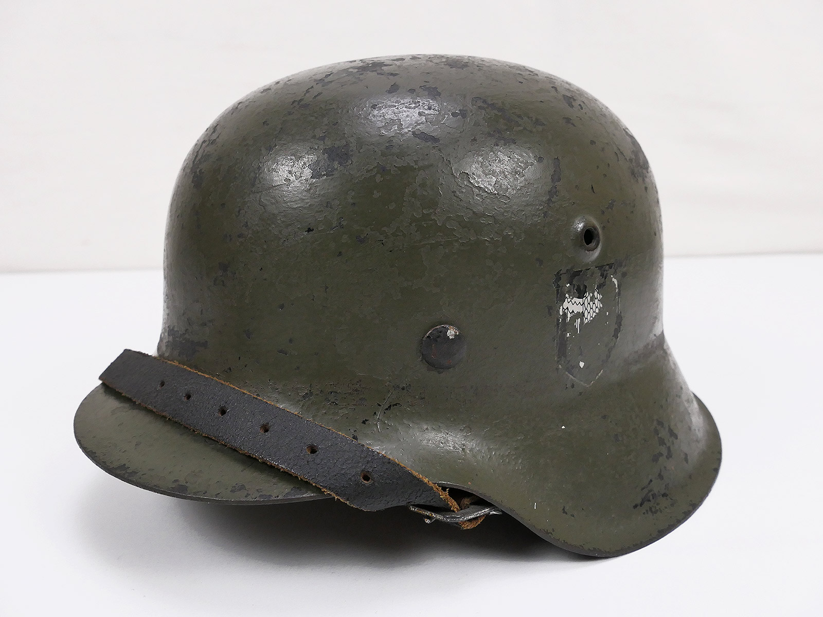 P1635807 Original Wehrmacht M42 steel helmet DD helmet hkp64 with remains of 2 badges and helmet lining