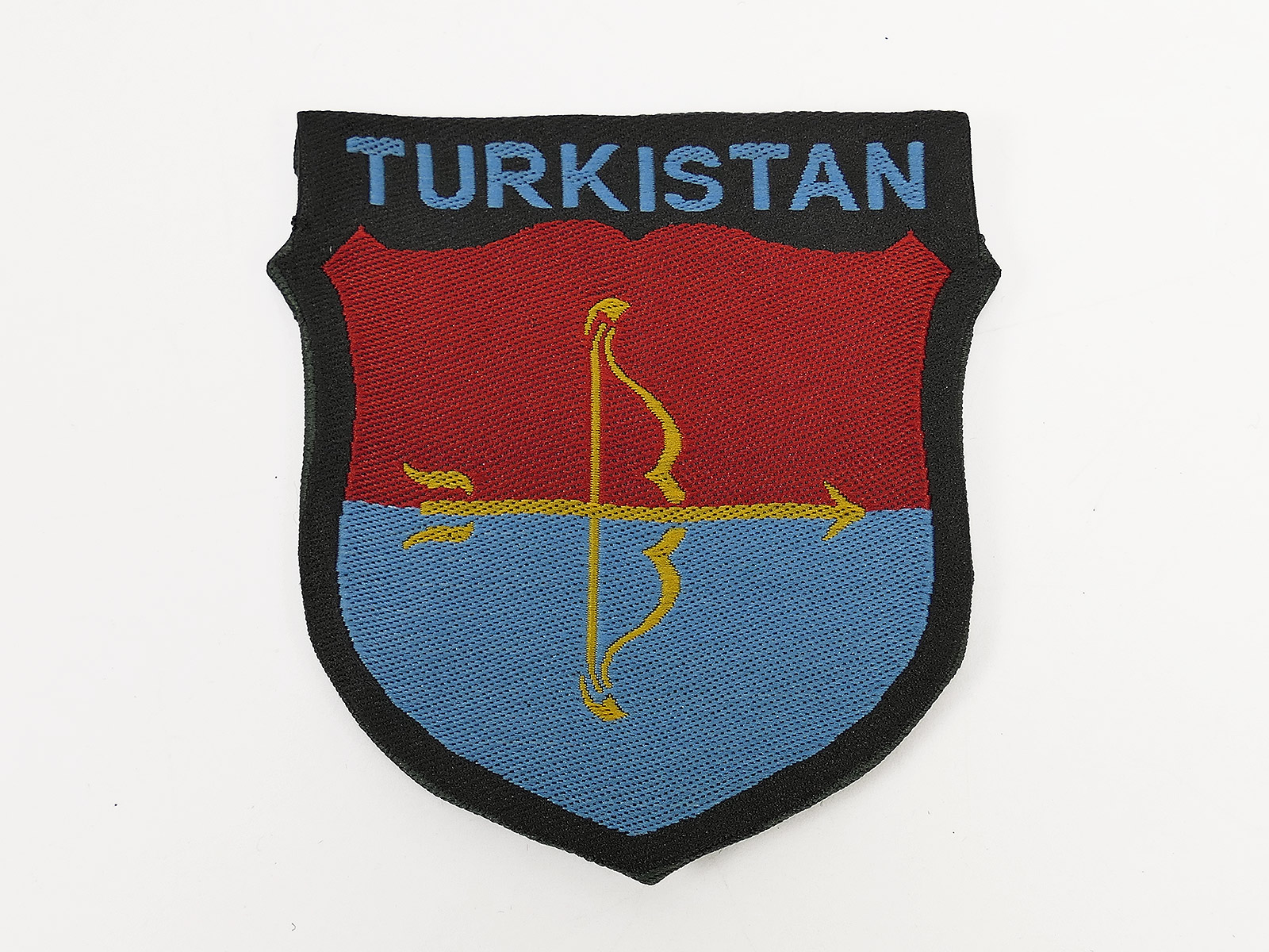 Field jacket sleeve badge: TURKISTAN Volunteer Division, Waffen-SS – woven, folded and turned back