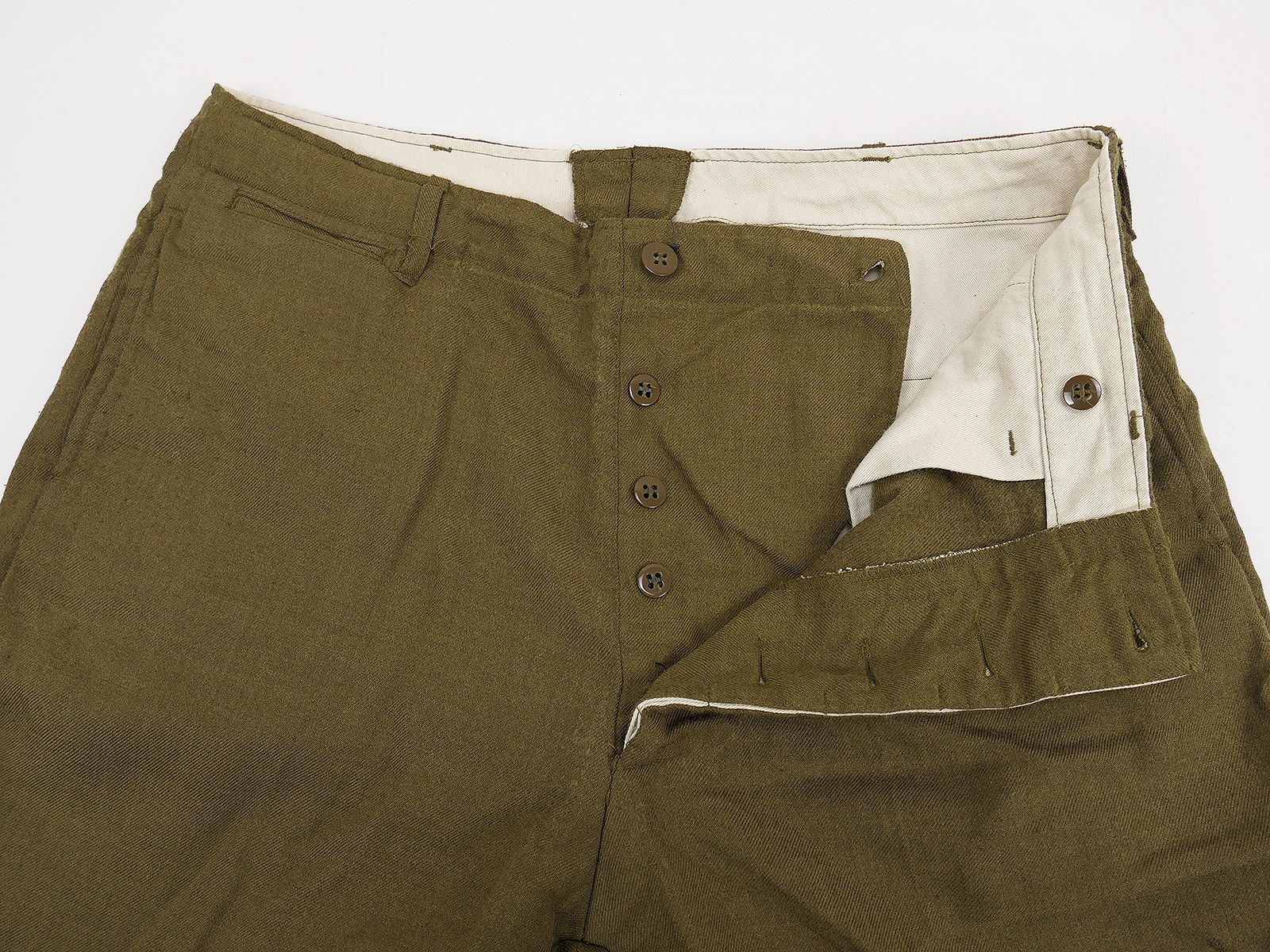 One-off pair of US Army WW2 M37 field trousers, size US W34, BATTLE WORN