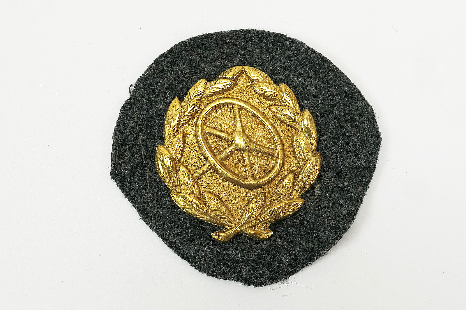 Wehrmacht badge Kraftfahrbewährungsabzeichen Gold on original fabric section