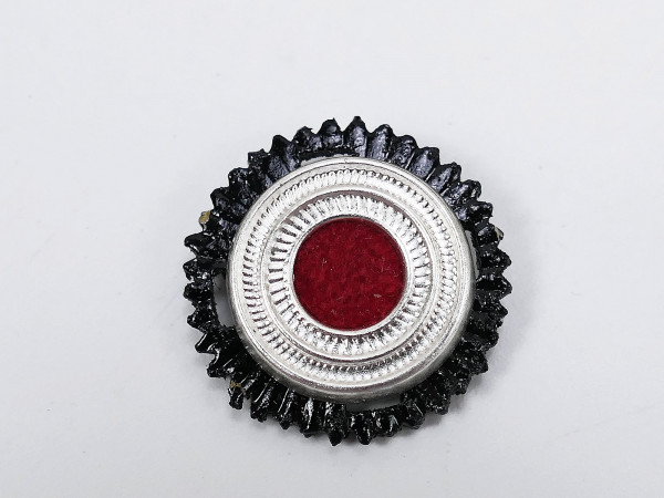 Wehrmacht officer's cockade metal with red felt inlay on cotter pins