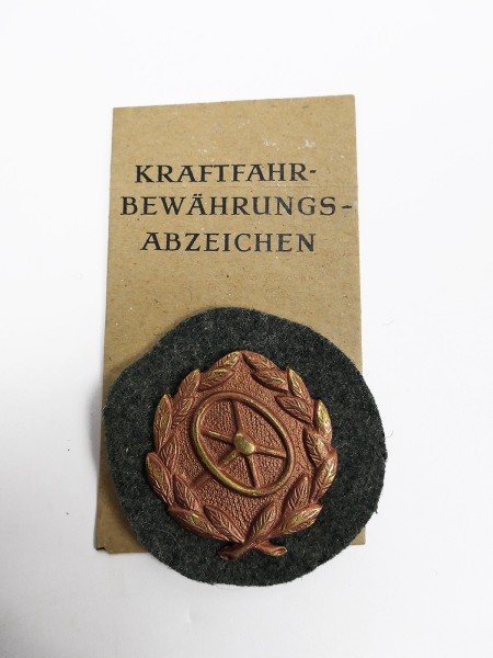 Wehrmacht badge "Kraftfahrbewährungsabzeichen Bronze" with award bag